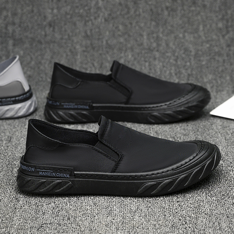 Zapatos de lona para hombres nuevos zapatos de trabajo negros simples de moda al por mayor.