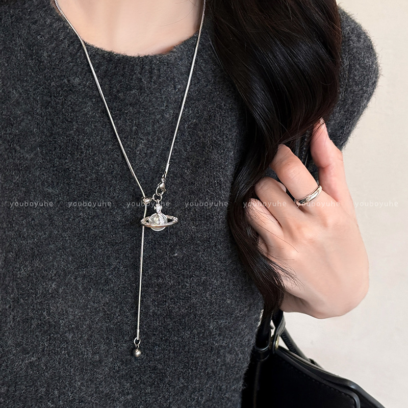 2026 New Style Pearl Saturn Pendant Necklace, High-End Adjustable Pull-Out Titanium Steel Sweater Chain Accessory for Women, Suitable for Autumn and Winter 2026 New Style Pearl Saturn Pendant Necklace, High-End Adjustable Pull-Out Titanium Steel Sweater Chain Accessory for Women, Suitable for Autumn and Winter