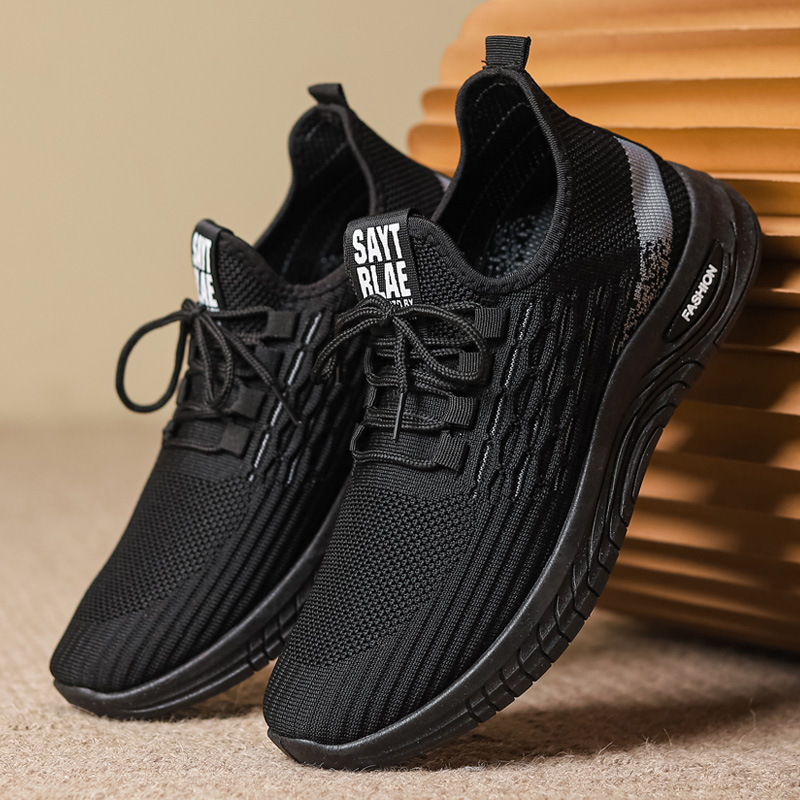 Nuevos zapatos de hombre transfronterizos primavera y otoño transpirables delgados deportes ociosos para correr tejido anti-deslizante hueco zapatos de moda comercio exterior