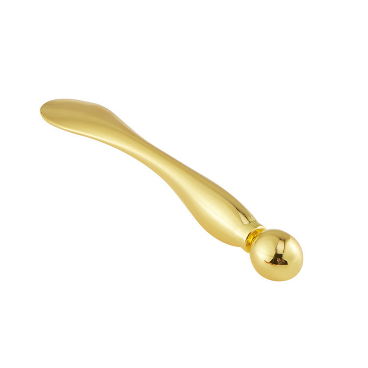 20236 golden drop eye cream stick black and white bag