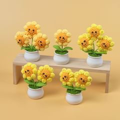 手作りの完成品は国境を越えて笑顔のひまわりの鉢植えが可愛いです。