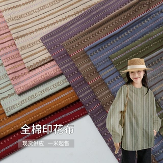 现货全棉平纹磨毛水浆印花面料喵鱼碎花布秋冬休闲长裤衬衫布料