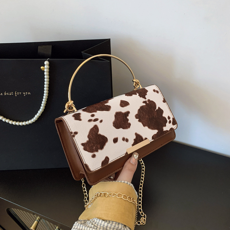 Moda coreana hermosa bolsa de mensajero occidental mujer 2025 nuevo diseño de nicho bolso de viaje personalizado todo-fósforo