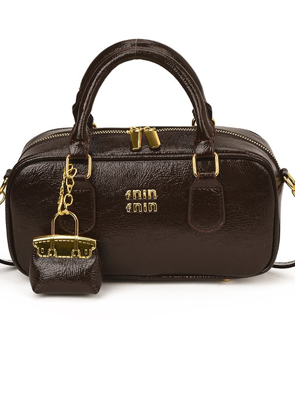 Bolso de bolos de mano popular de este año para mujeres 2026 nuevo sentido transfronterizo de alta calidad de viaje al trabajo mochila de hombro
