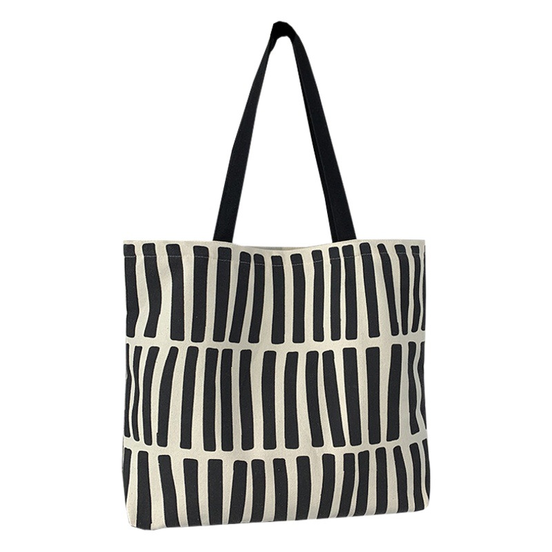 Bolsa de lona de diseño simple nueva 2025 para mujer, bolso de hombro para estudiantes universitarios, bolso de compras de lona con cremallera.