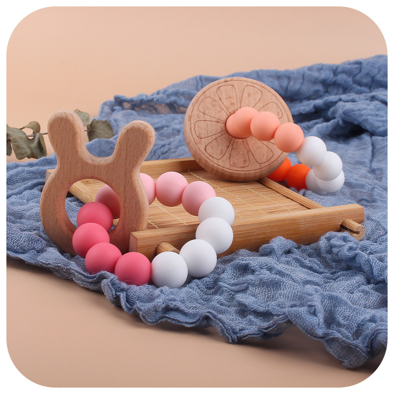Nueva DIY creativo de dibujos animados juguete de haya mordedor bebé Beech biberón cuentas de silicona pulsera teether stick