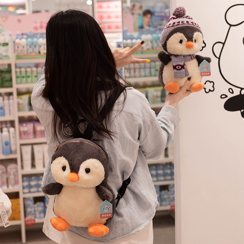 Nuevo creativo lindo invierno muñeca pingüino mochila muñeca de dibujos animados pingüino muñeca de niños almohada agarrar muñeca lote