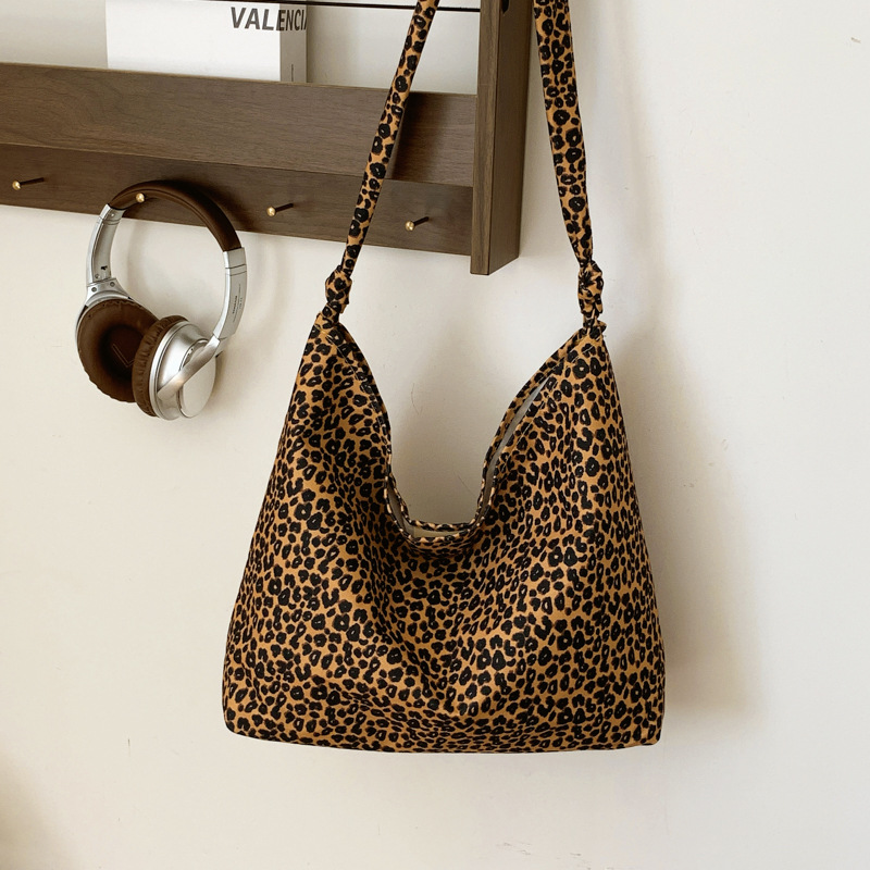 Estudiantes universitarios clase de viaje bolsa de gran capacidad para mujeres 2024 nueva moda extranjera leopardo tela mochila