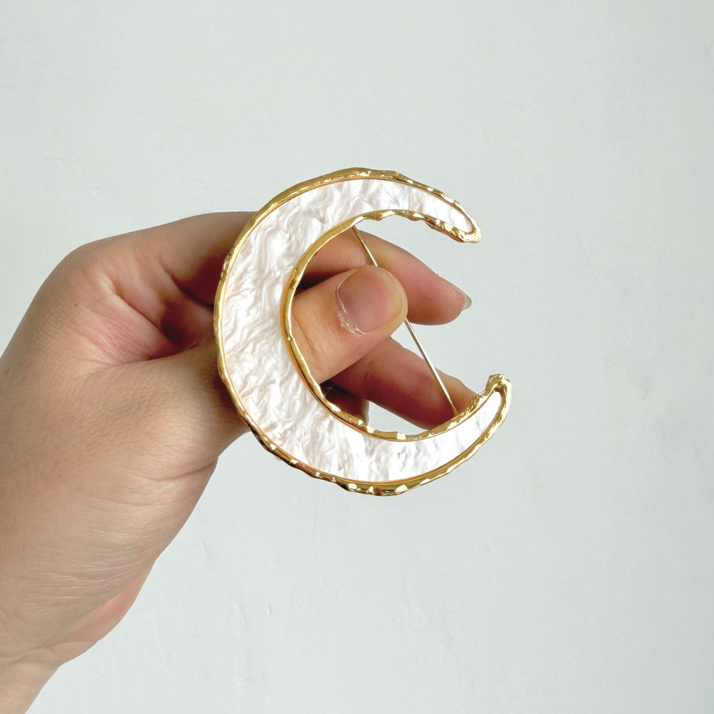 French vintage crescent moon brooch, red and white enamel with metal edges, niche accessory for suit jackets
