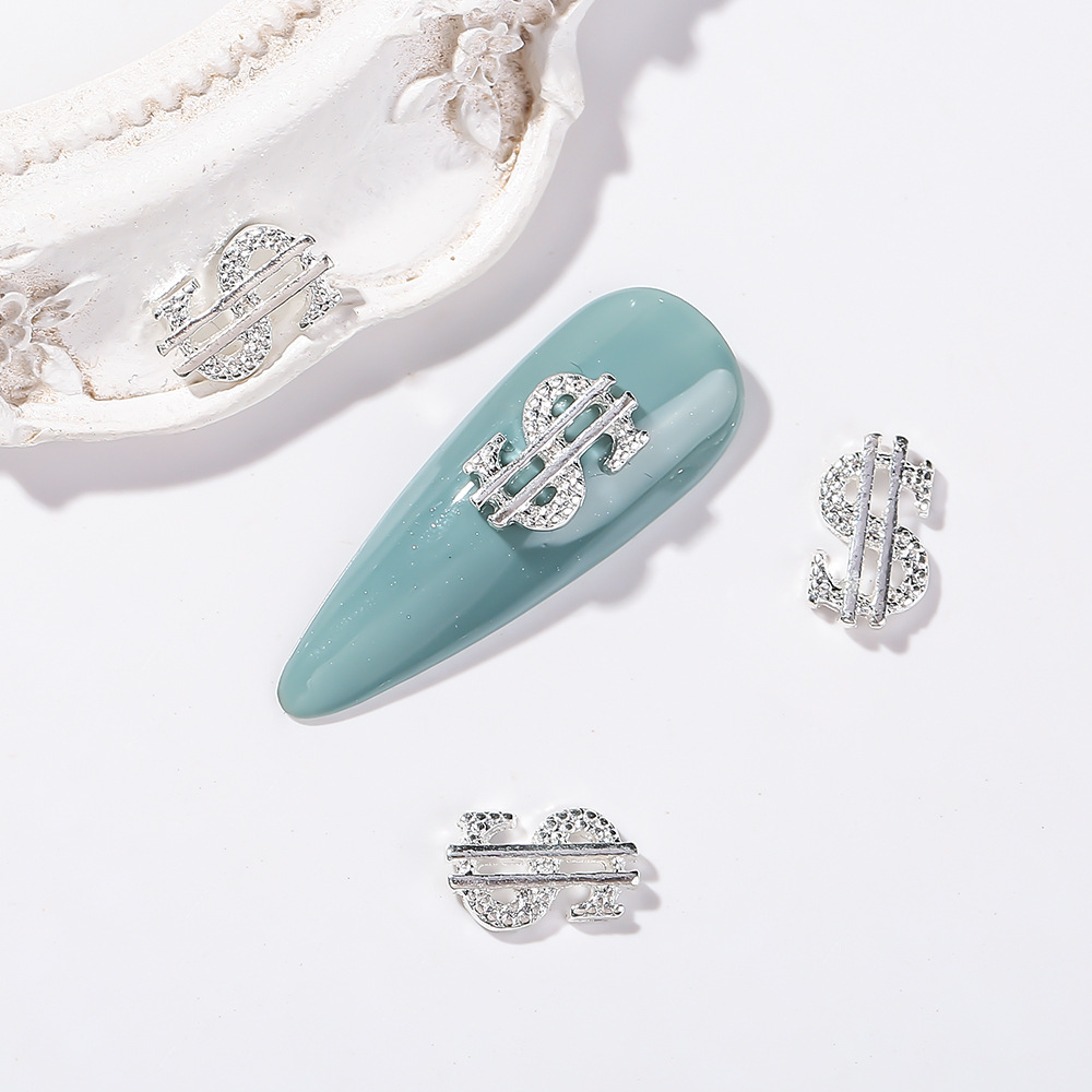 Joyería de uñas transfronteriza oro plata dólar símbolo moneda símbolo de uñas Luz de lujo flash diamante tridimensional decoración de diamantes