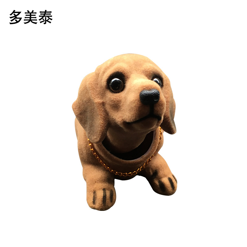 Suministro directo de fábrica resina flocado simulación salchicha perro cabeza móvil perro decoración del coche accesorios del coche simulación perro Decoración