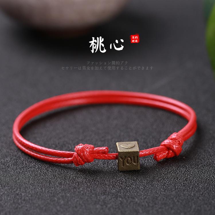 Pulsera tejida a mano – motivos trébole/póker, estilo unisex vintage