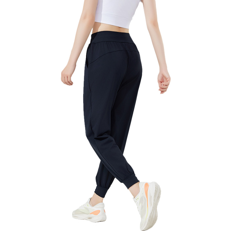 Pantalones deportivos casuales elásticos y transpirables estilo otoño 2026 para mujer, ideales para yoga, correr y fitness al aire libre.