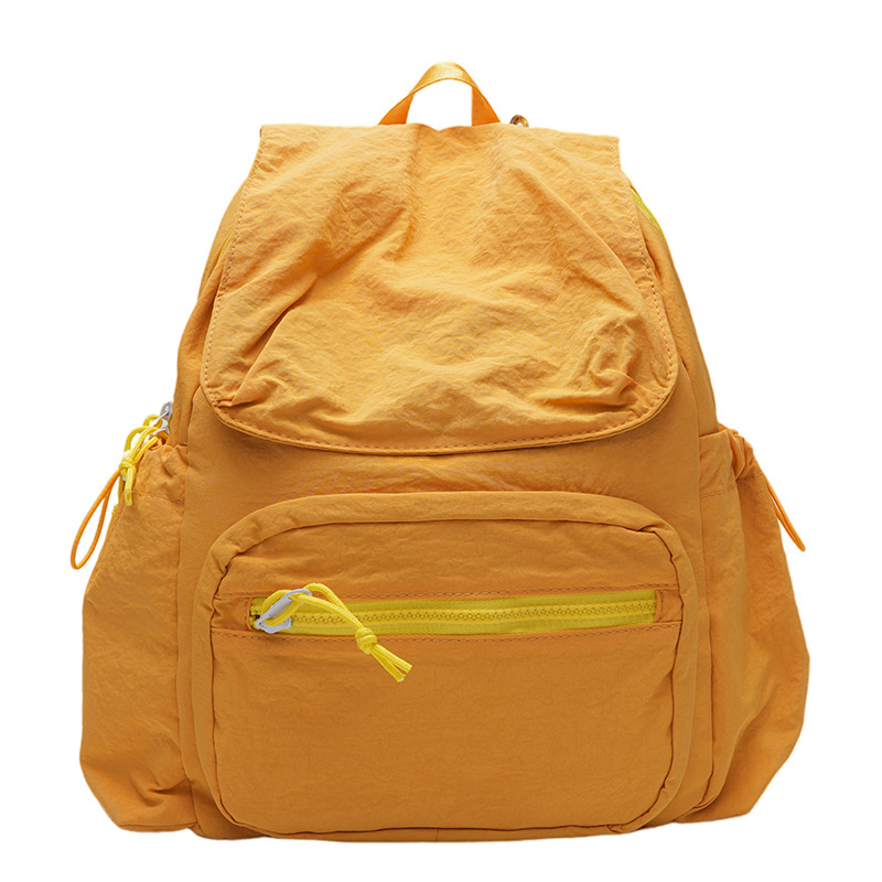 2024 nueva mochila casual de nailon, mochila escolar pequeña de color sólido de viaje coreano, bolsa de clase ligera de gran capacidad y versátil