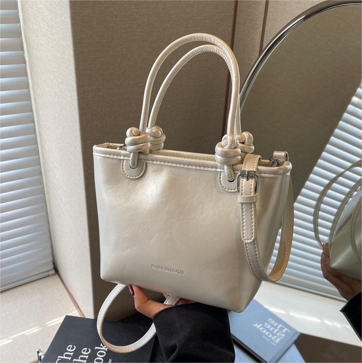 Moda nicho bolso de cubo de mano para mujeres 2024 nuevo estilo coreano simple bolso de hombro de diseño de alto nivel bolso de mochila