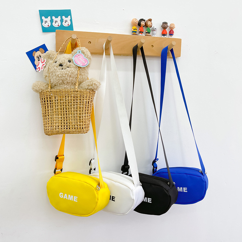 Bolso bandolera 2025 con diseño de letras para niños y niñas de preescolar, monedero versátil, bolso de lona ligero informal, bolso de viaje