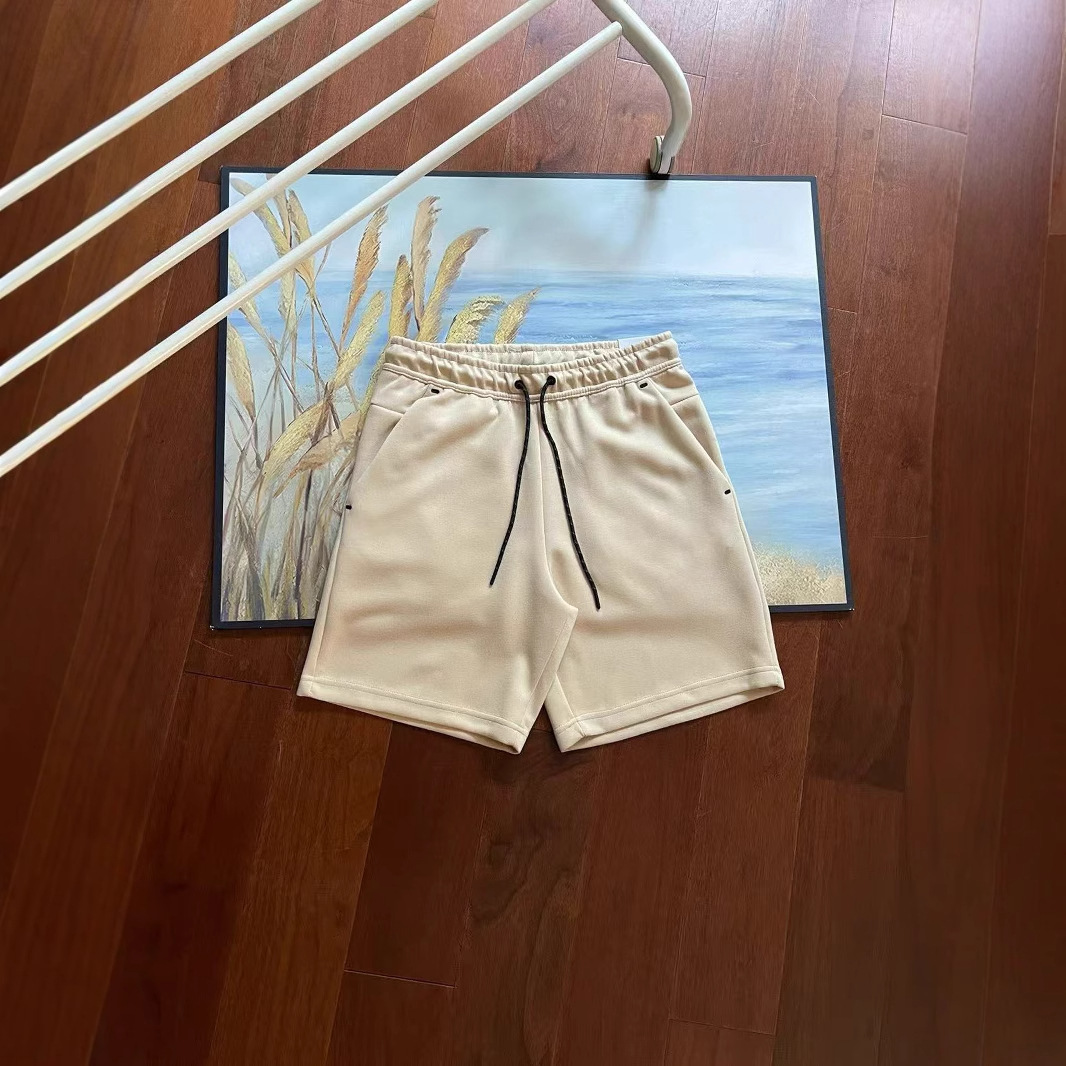 Verano nuevo estilo pequeño gancho versión en el extranjero de doce colores pantalones cortos deportivos de punto de pegamento lateral para hombres pantalones de cinco puntos 4503