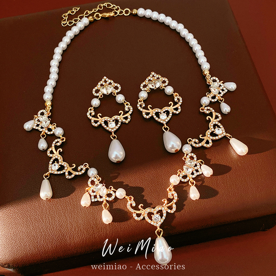 Collar de perlas de diamante vintage medieval de gota de amor ligero lujo nicho cadena clavícula de alta calidad conjunto de joyas