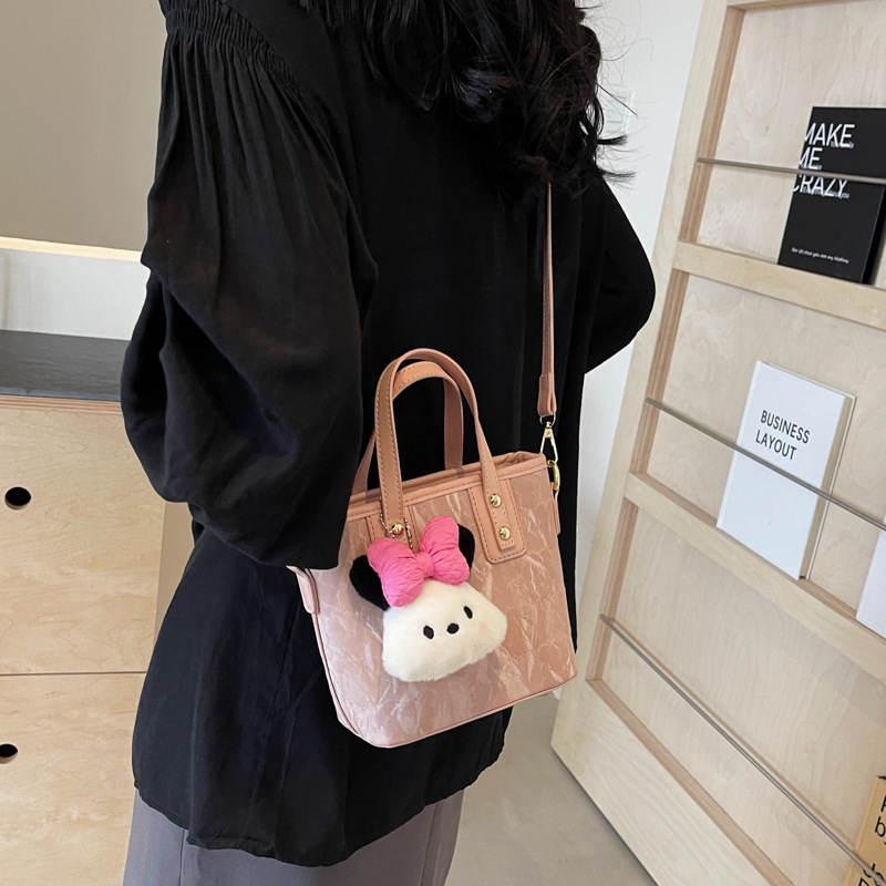 Bolsa de cubo de mano de moda coreana para mujeres primavera y verano 2024 nuevo nicho casual de moda universal mochila de hombro