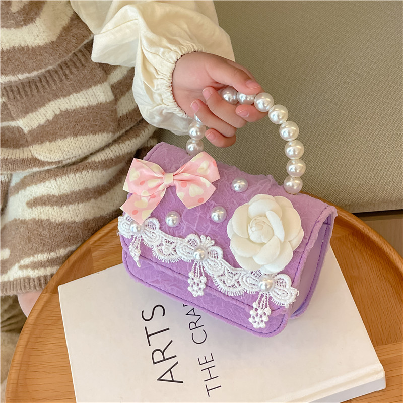 Bolsa para niños bolsa de mensajero de aire exterior 2022 nueva niña moda linda princesa bolsa de hombro pequeña fragancia bolso