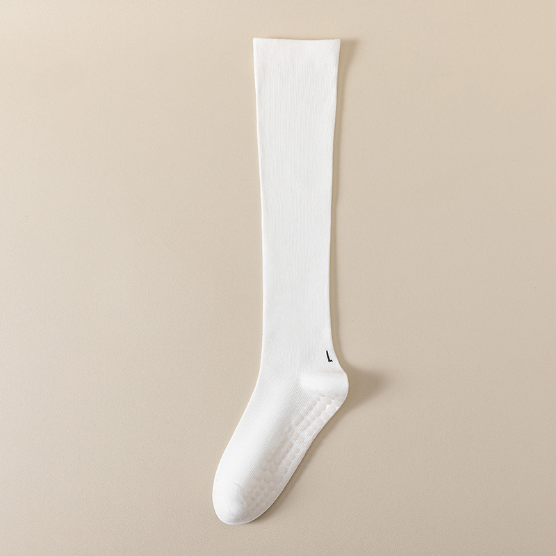 圧力の靴下の子供のヨガの靴下の高い筒の綿の純色のふくらはぎの靴下の卸売りのフィットネスのダンスの滑り止めのプラティのストッキング
