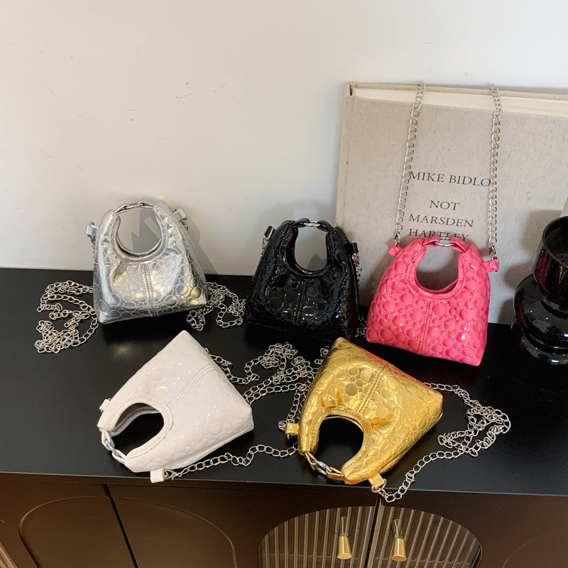 Paquete compacto mini bolso de hombro para niños y niñas coreanos simple bolso de bebé de color sólido 2026 nuevo bolso de cambio para niños