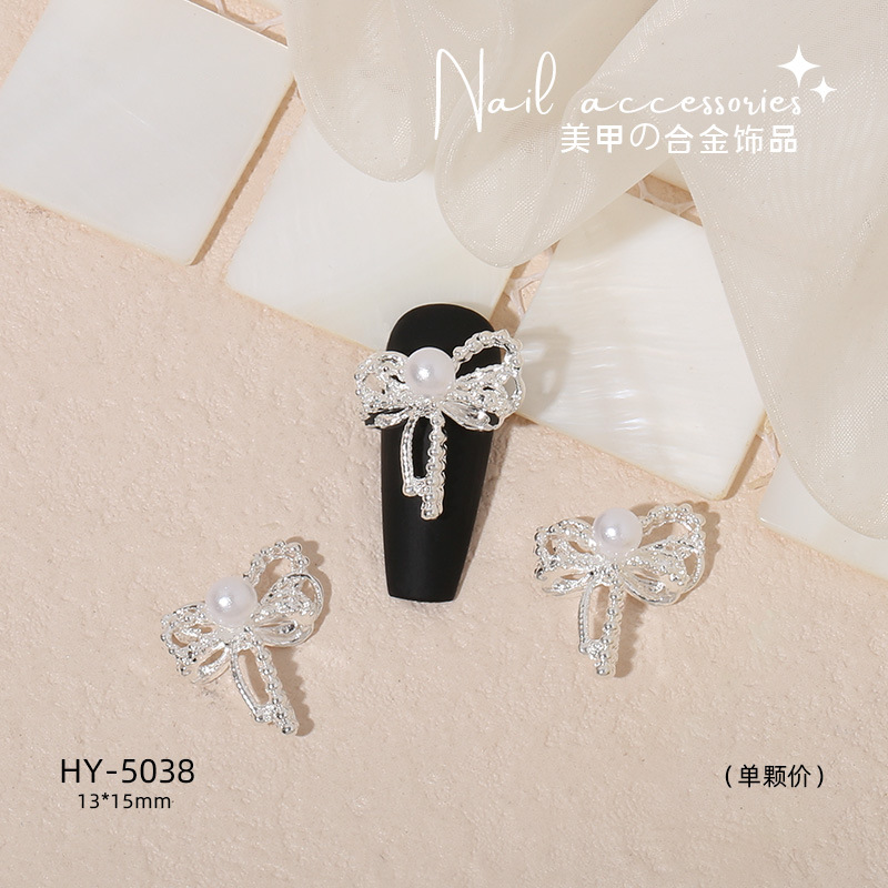 Nuevo arco de uñas amor aleación decoración de uñas flor de la luna mariposa clavo taladro fábrica joyería al por mayor