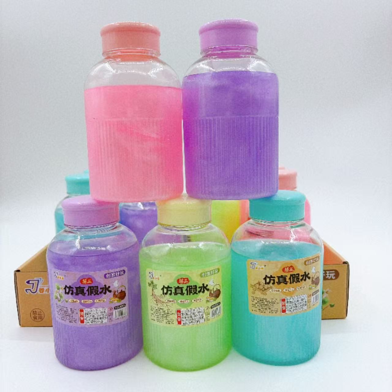 Nuevo juguete para niños, botella redonda, agua falsa, color, limo antiadherente, arcilla de color a mano, pegamento espumoso, descompresión, lote de grandes almacenes de 2 yuanes