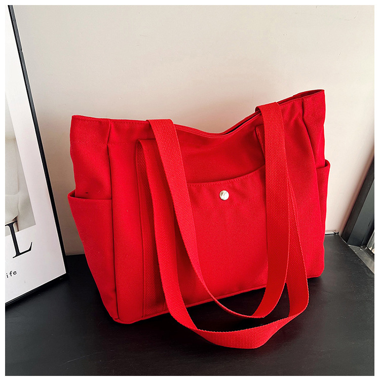 Wholesale of new women's single-shoulder bags, cross-border simple and casual canvas bags, Korean version LOGO printed commuter tote bags undefined