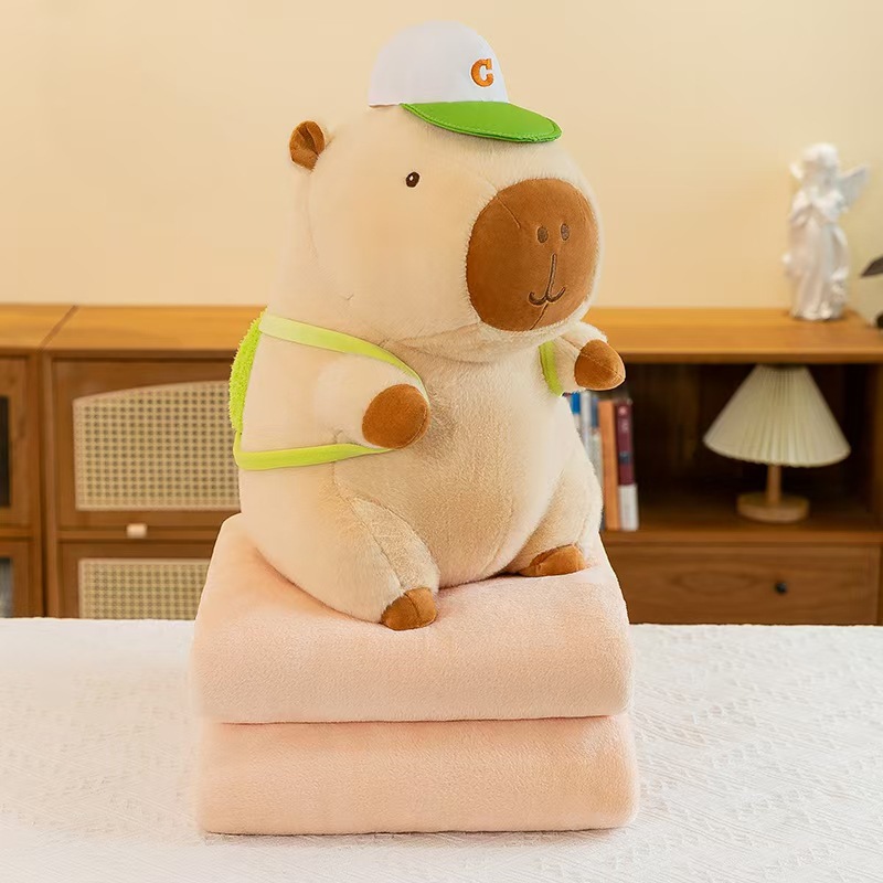 Caricatura capibara almohada manta dos en uno Carpibara cojín aire acondicionado es de doble uso niños siesta manta regalo