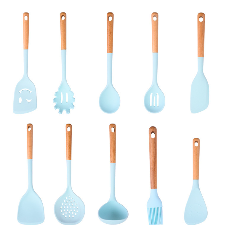 Suministros de cocina Mango de madera de silicona sartén antiadherente europea Espátula de silicona Juego de 10 piezas Juego de utensilios de cocina azul resistente a altas temperaturas
