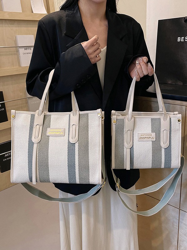 Bolso Tote portátil a rayas de color de contraste de lona para mujer 2024 nueva textura de moda transfronteriza bolso de mensajero de un solo hombro