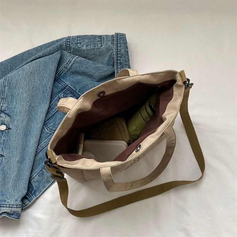 Fashionable retro one-shoulder city bag with increased thickness, available in black, white, and dark khaki
