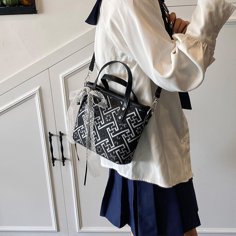 Bolso de cubo de agua súper fuego popular de verano para damas 2025 nuevo bolso de mano de tendencia salvaje bolso de mensajero de estilo nacional de sentido avanzado