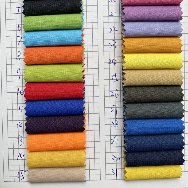 格中点PVC 户外冲锋衣防寒服面料 春亚纺提花格 格中点春亚纺布料