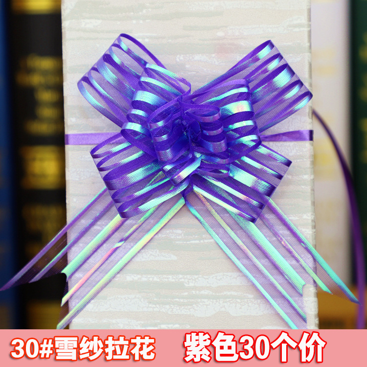 手拉花の結婚車の蝶結びの花の贈り物の包装は花の色の条を引き出して本のリボンのリボンの本を縛って賞状を縛ります。|undefined