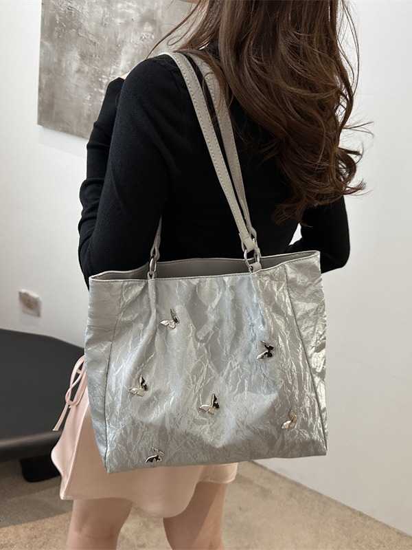 Bolsos de cubo de arco de alta calidad para mujeres 2024 verano nuevo estilo extranjero nicho bolso de hombro de moda bolso de mujer