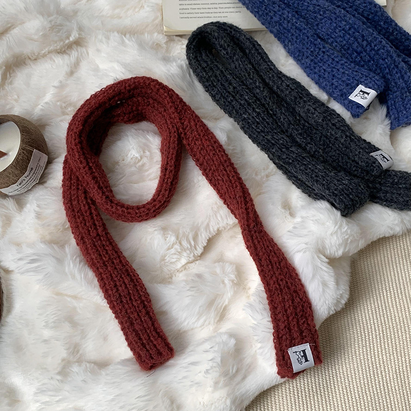 Otoño y invierno bufandas mujeres 2025 nuevo color sólido caliente de protección de cuello de lana de punto largo bufandas al por mayor