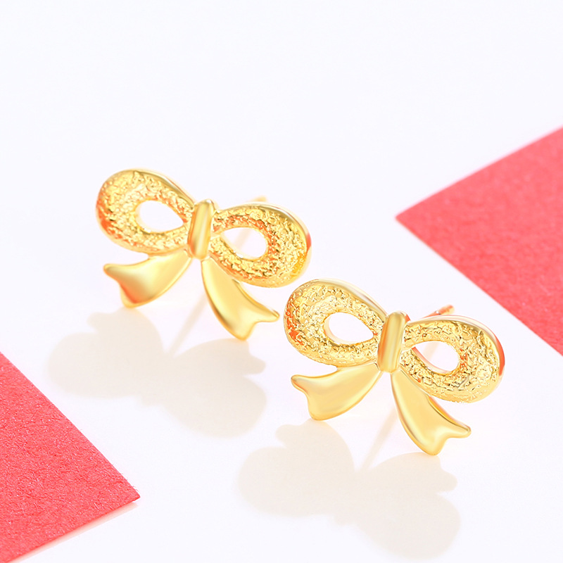 Joyería Xuping arco pernos de orejas imitación de oro encantador temperamento pequeño pendientes femeninos dulces coreanos en forma de corazón