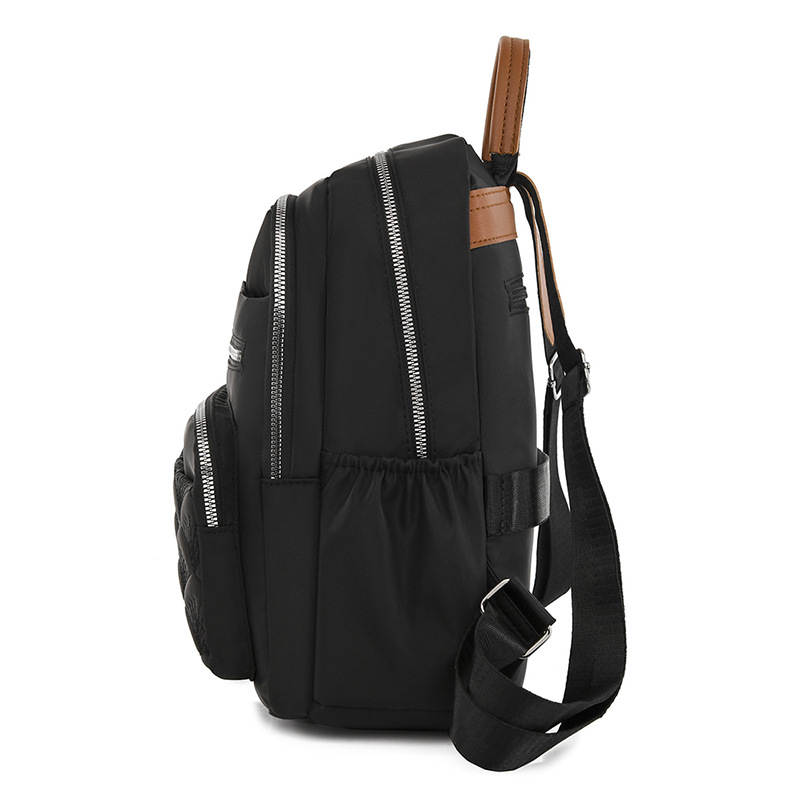 Comercio exterior al por mayor 2023 nueva mochila de tela Oxford para mujer retro casual, bordado de moda, mochila de viaje ligera