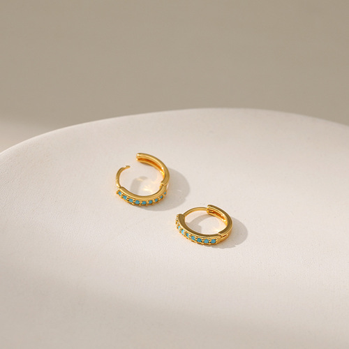 Earrings with a cool and chic style, plated with 18K gold, featuring a circle design with micro-set turquoise accents, embodying a light luxury feel.
