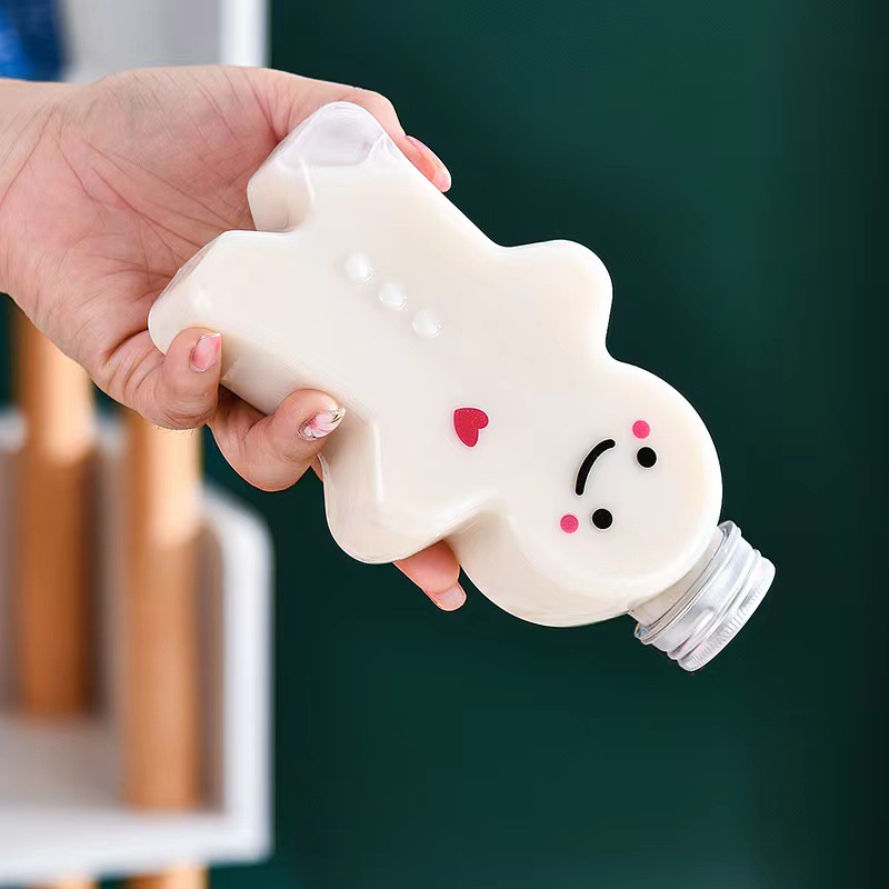 Pastel de jengibre de dibujos animados Hombre taza de té de leche en forma de botella de plástico desechable jugo botella de bebida PET para llevar jugo de leche botella de té