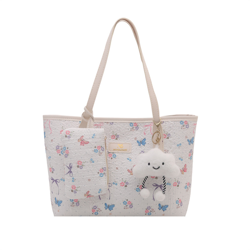 2026 flores coreanas mariposas de gran capacidad de viaje de primavera nueva moda moda extranjera bolso de hombro