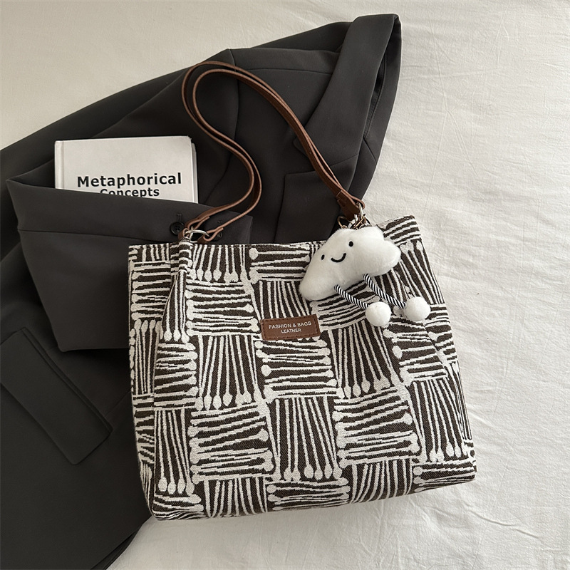 Bolso a rayas casual de todos los partidos de nicho para mujer 2024 nuevo bolso de hombro de gran capacidad de moda retro bolso de viaje