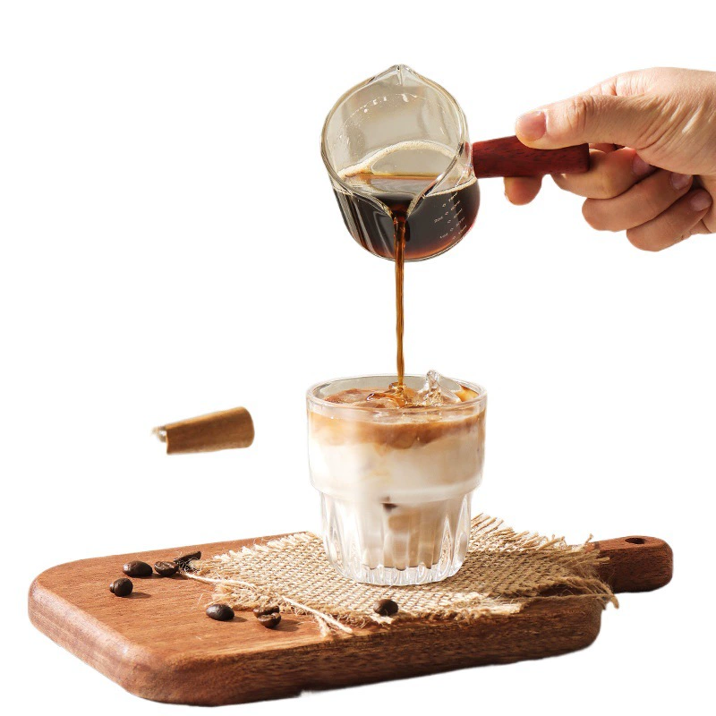 Coffee extract, measuring cup, glass concentrate scaled