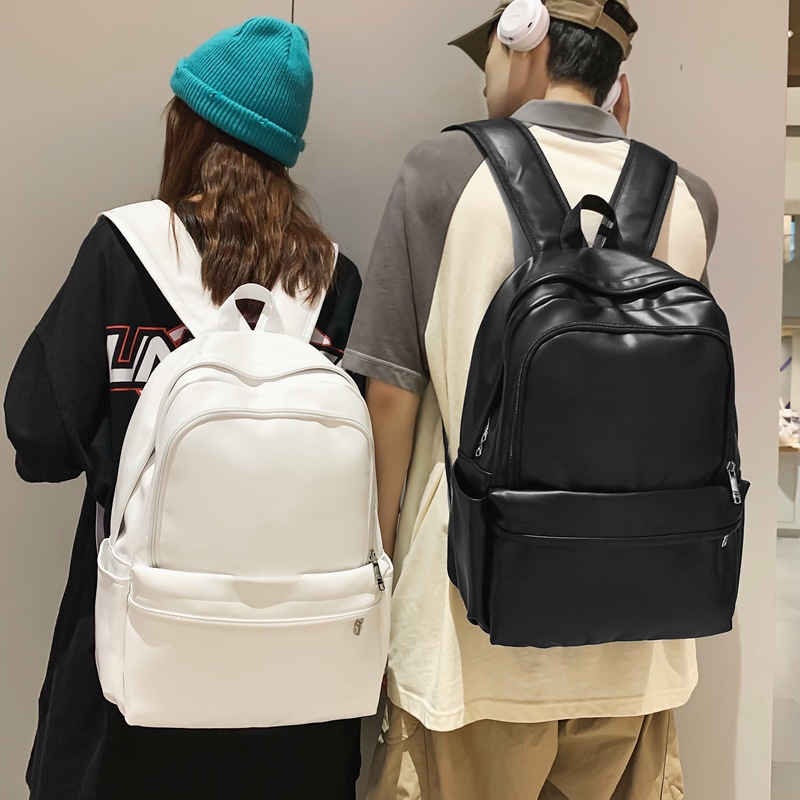 Comercio exterior nuevo estilo cuero suave gran capacidad color sólido escuela de secundaria mochila de moda masculina todo fósforo mochila simple japonesa