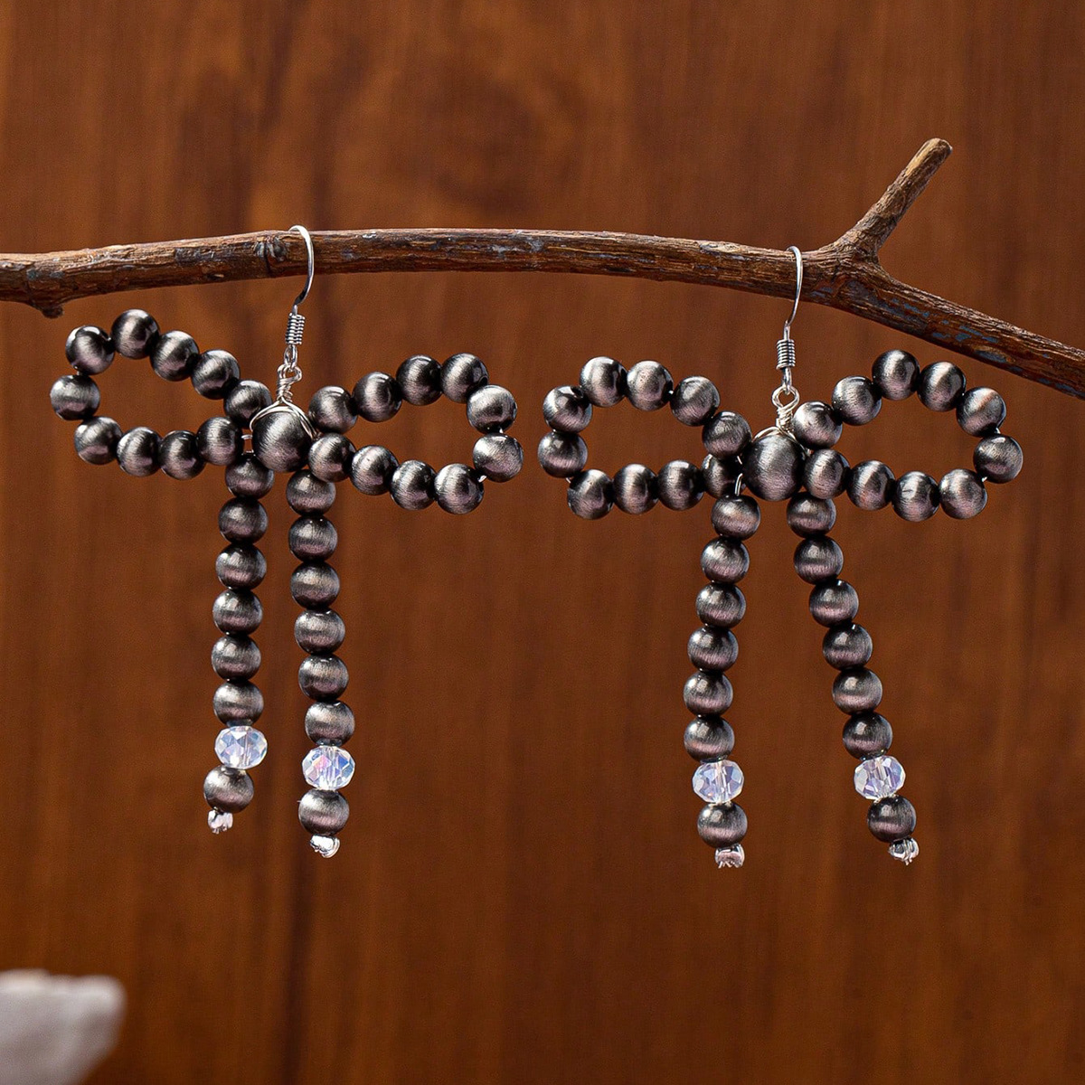 Qingdao Daiwei European and American Retro Western Cowboy Style Simple Brushed Bead Bow Women's Pendant Earrings