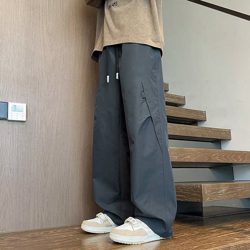 Marca de moda americana de piernas largas sueltas pantalones largos casuales para hombres nuevos pantalones de paracaídas de otoño rectos pantalones de trabajo versátiles