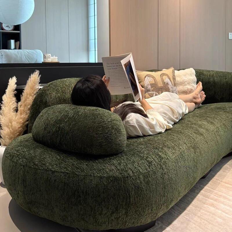 Curved chenille sofa, uniquely shaped corner sofa for living rooms, designed for large, open-plan living spaces, French-style cream-colored sofa with a sea salt accent Curved chenille sofa, uniquely shaped corner sofa for living rooms, designed for large, open-plan living spaces, French-style cream-colored sofa with a sea salt accent