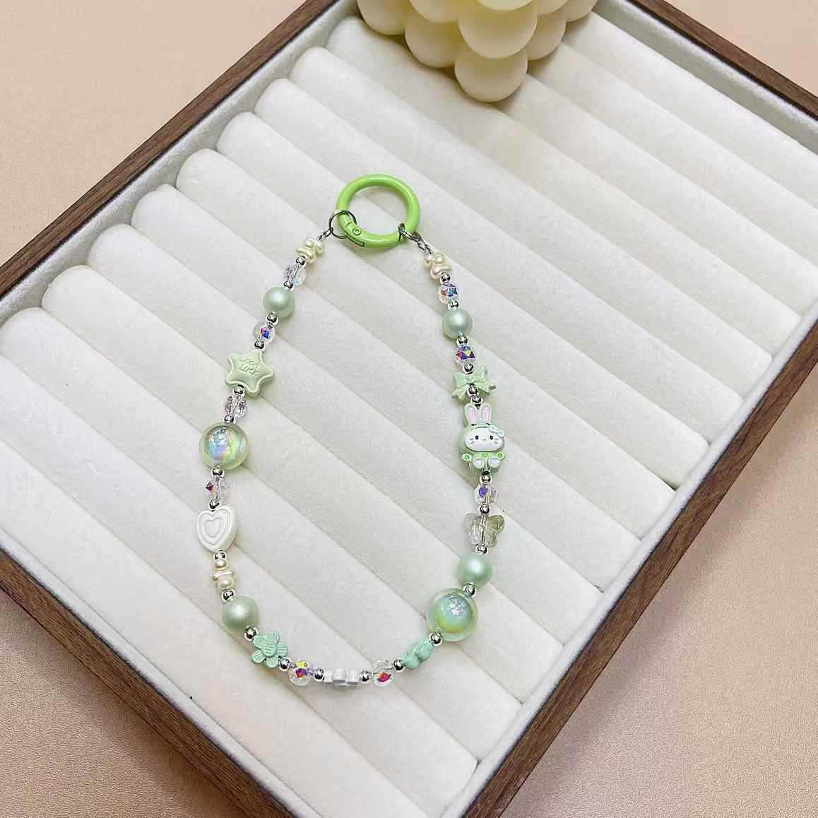 Creativo de dibujos animados KT conejo aleación cadena teléfono móvil cordón muñeca nuevo DIY hecho a mano cuentas estrella de cristal colgante de equipaje